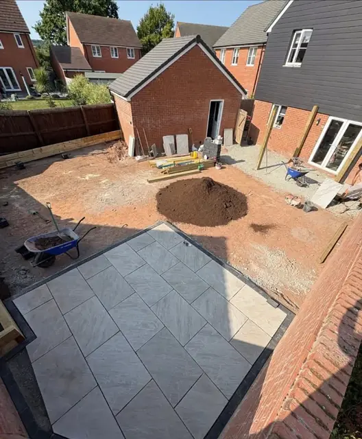 Paving going down around the back of a house, seen from above