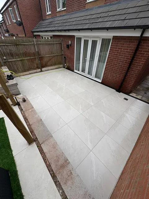 White porcelain paving laid around a conservatory